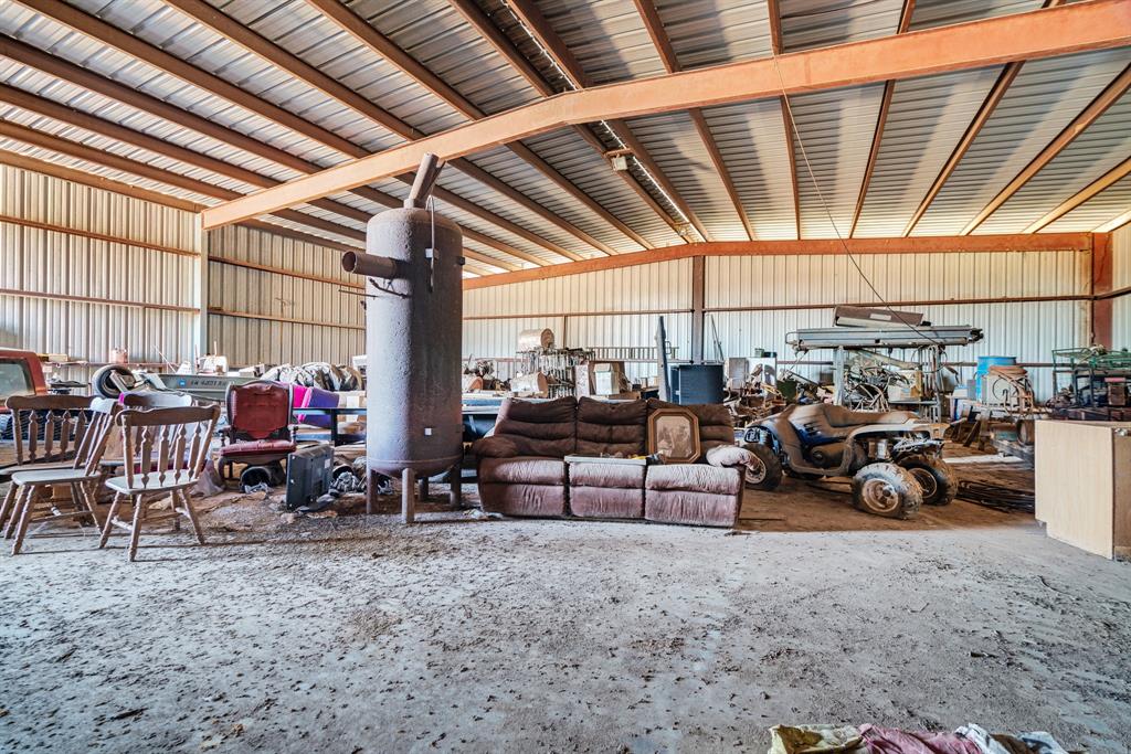 4060 County Road 36220 Sumner, TX 75486 - Photo 28 of 40 a view of a garage with chairs