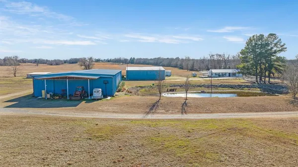 a view of a swimming pool with a yard