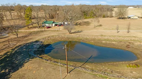 a view of a lake with houses in the back