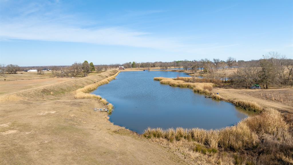 4060 County Road 36220 Sumner, TX 75486 - Photo 37 of 40 a view of a lake with houses in the back