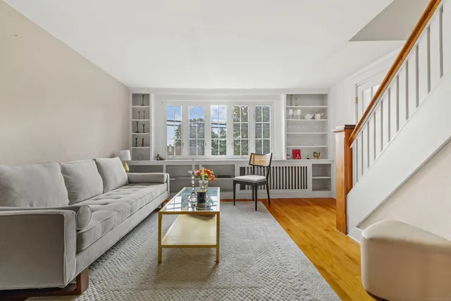 a view of a dining room with furniture and a window