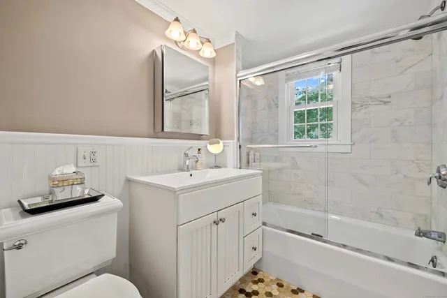 a bathroom with a sink and a window