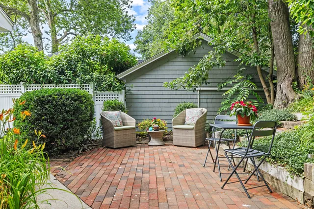 a view of a deck with furniture and potted plants