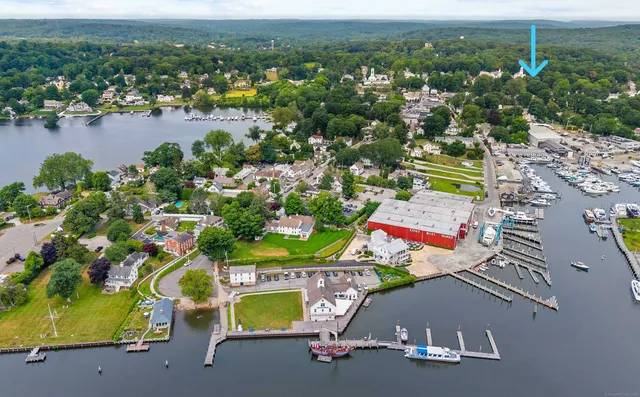 a view of a room with wooden floor and windows