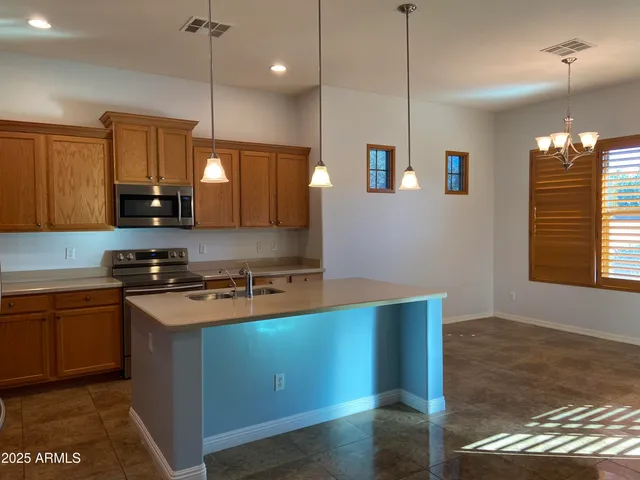 a white toilet and tub sitting next to a bathroom sink
