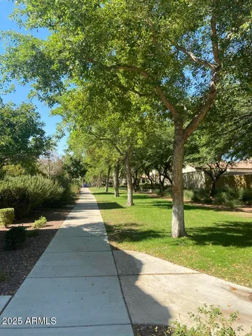 a view of a porch with chairs and backyard