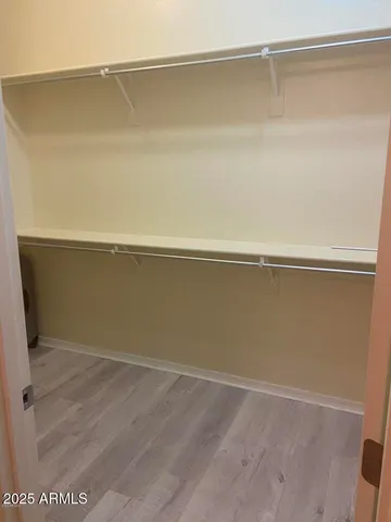 a kitchen with kitchen island a sink a counter space and stainless steel appliances