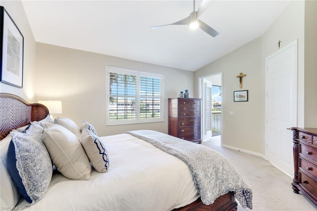 3048 Horizon Lane, Unit 1108 Naples, FL 34109 - Photo 11 of 23 a bedroom with bed and a window