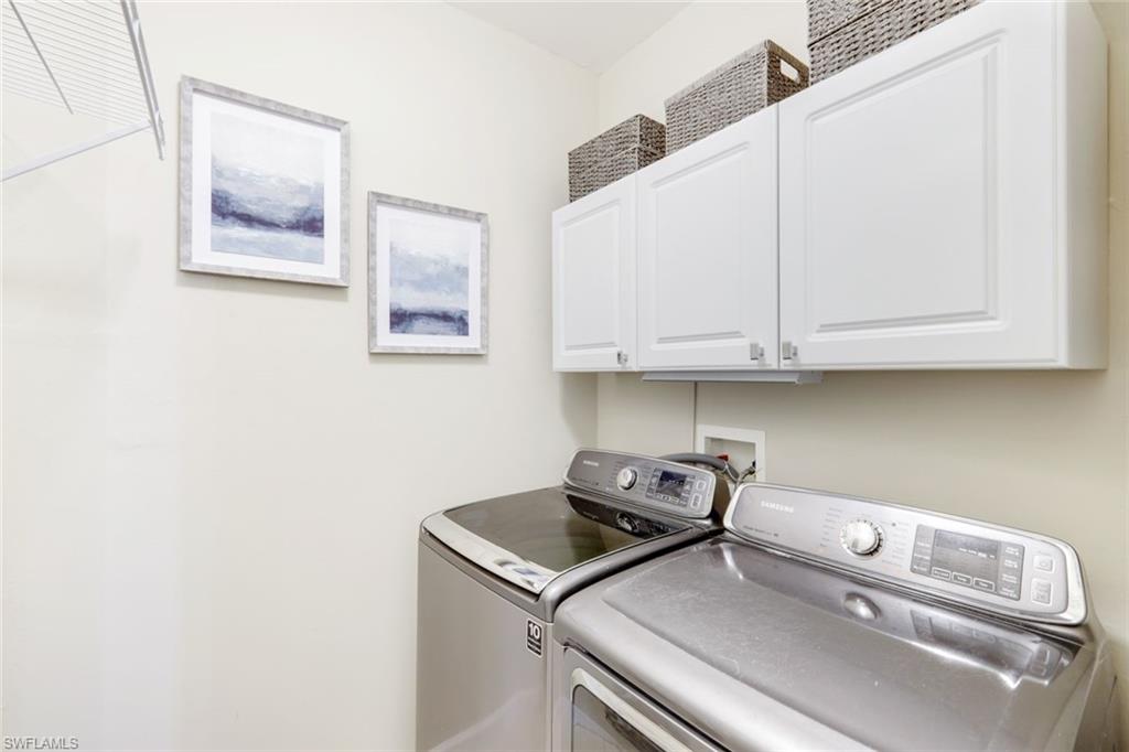 3048 Horizon Lane, Unit 1108 Naples, FL 34109 - Photo 18 of 23 a utility room with dryer and washer