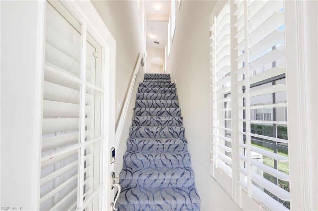 3048 Horizon Lane, Unit 1108 Naples, FL 34109 - Photo 19 of 23 a view of a hallway with wooden floor and entryway