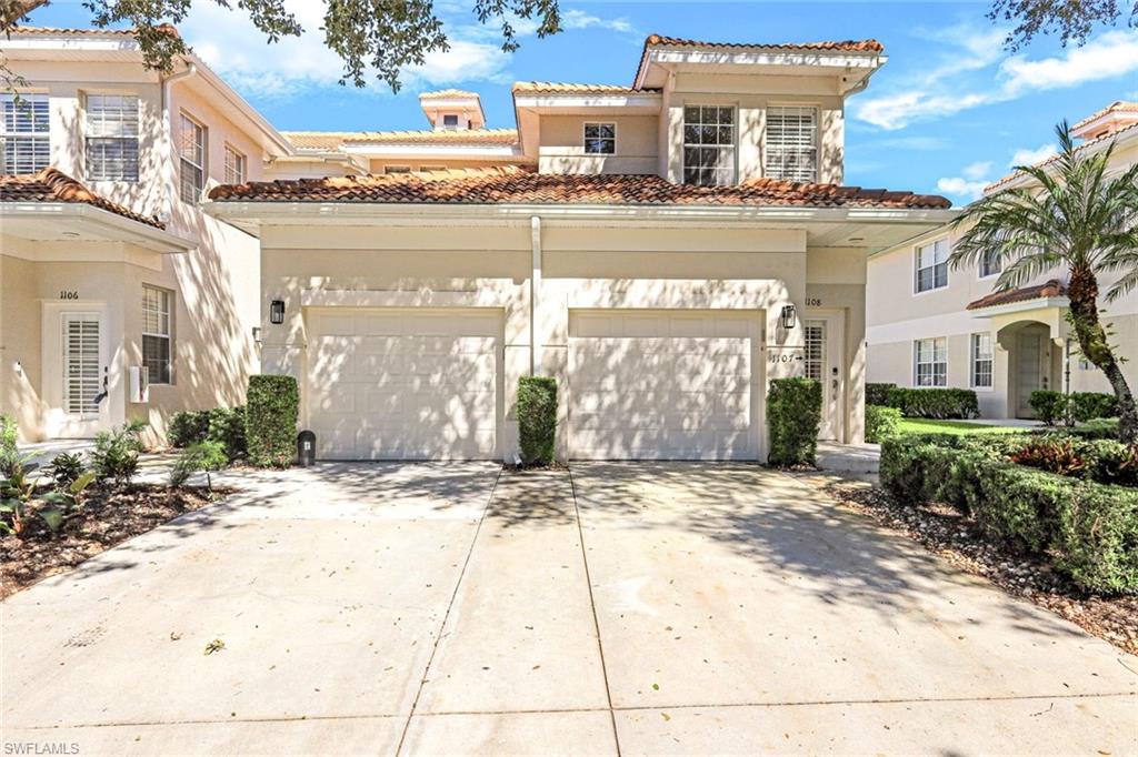 3048 Horizon Lane, Unit 1108 Naples, FL 34109 - Photo 2 of 23 a view of a building with a street