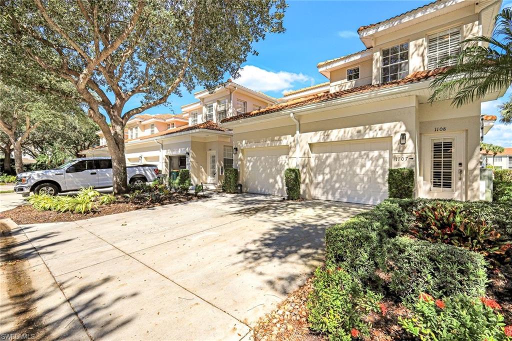3048 Horizon Lane, Unit 1108 Naples, FL 34109 - Photo 22 of 23 a front view of a building with street