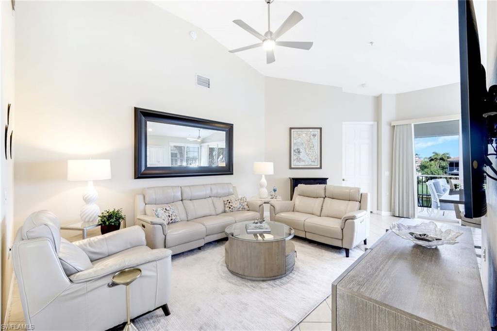 3048 Horizon Lane, Unit 1108 Naples, FL 34109 - Photo 4 of 23 a living room with furniture and a large window