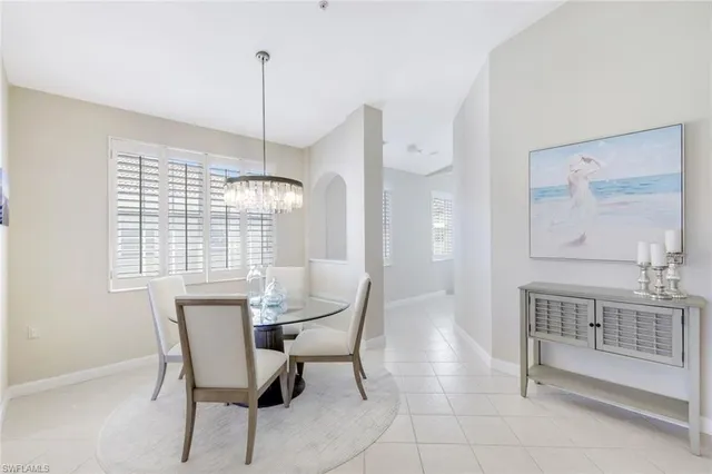 a bedroom with a bed and a night stand