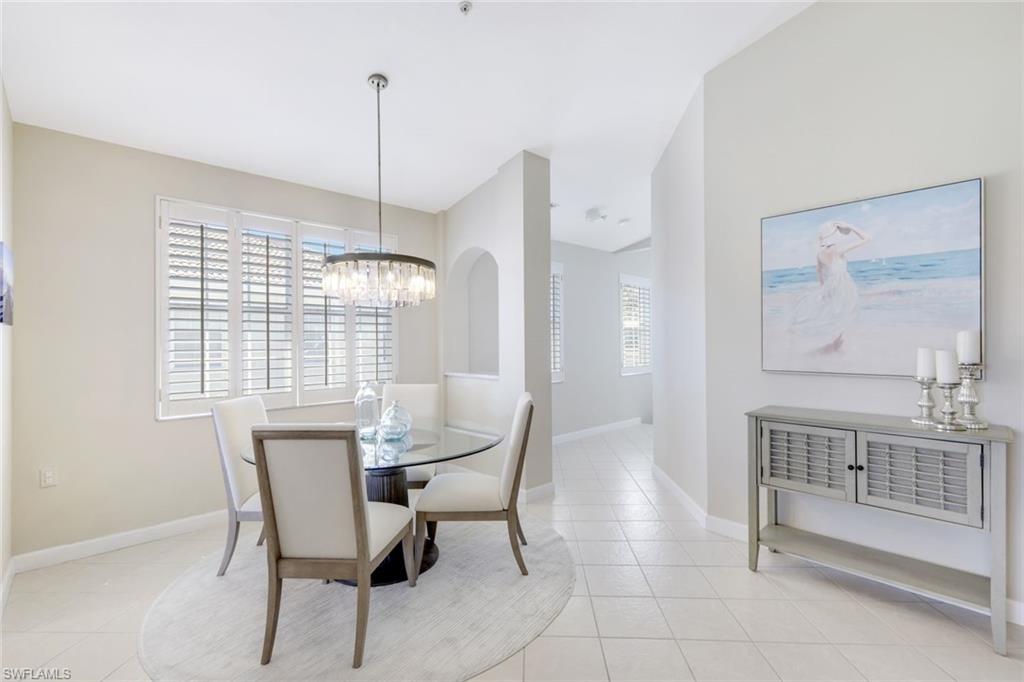 3048 Horizon Lane, Unit 1108 Naples, FL 34109 - Photo 9 of 23 a dining room with furniture and window