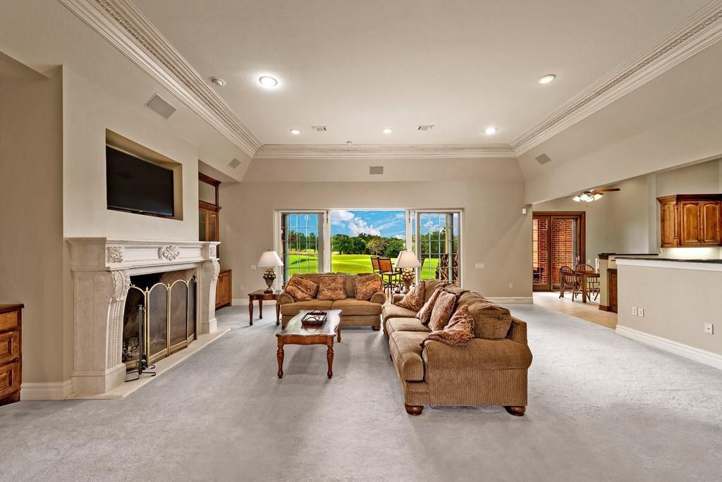 113 Shadow Crk Road Gordonville, TX 76245 - Photo 11 of 35 a living room with furniture a fireplace and a flat screen tv