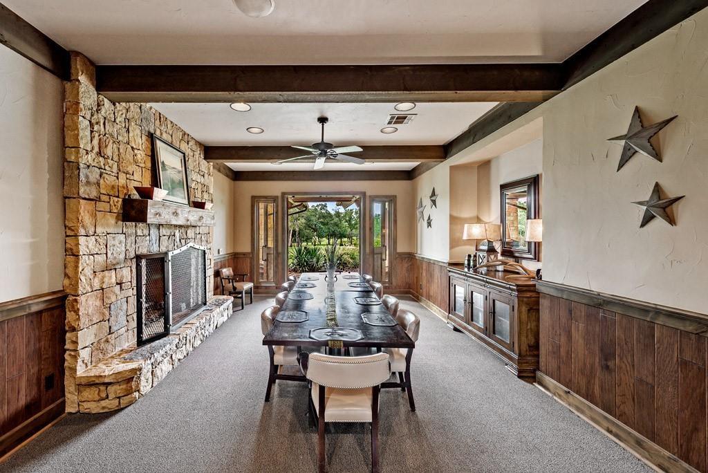 113 Shadow Crk Road Gordonville, TX 76245 - Photo 6 of 35 a dining room with furniture a fireplace and wooden floor