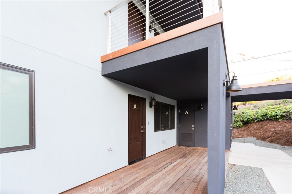 210 Laurel Street, Unit A Avila Beach, CA 93424 - Photo 2 of 16 a view of a house with a balcony