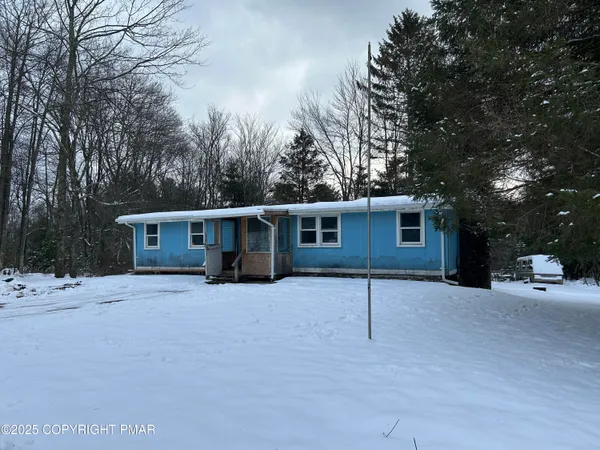 a house with trees in the background