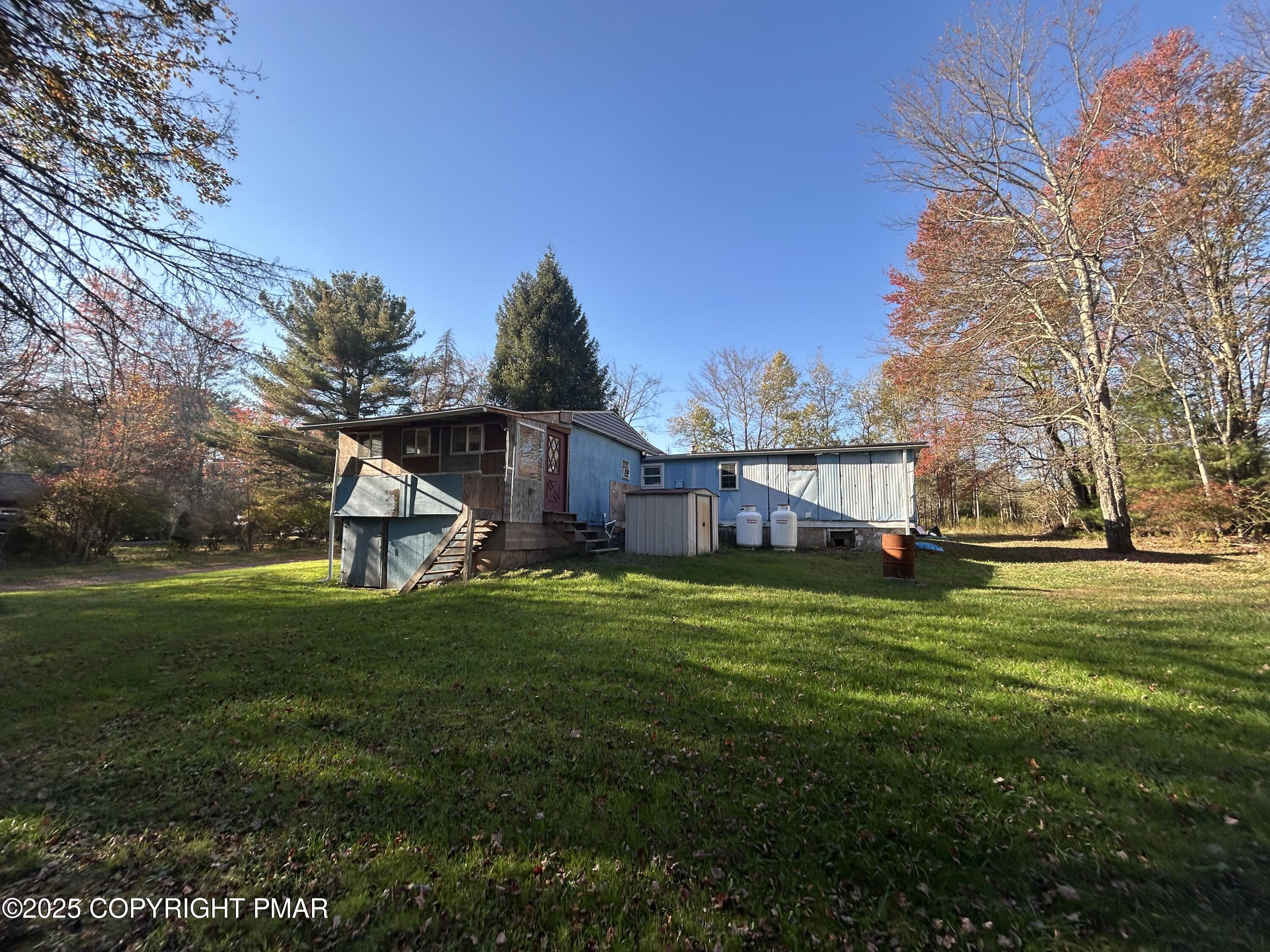 1280 Old Coach Drive Blakeslee, PA 18610 - Photo 2 of 5 a front view of a house with garden
