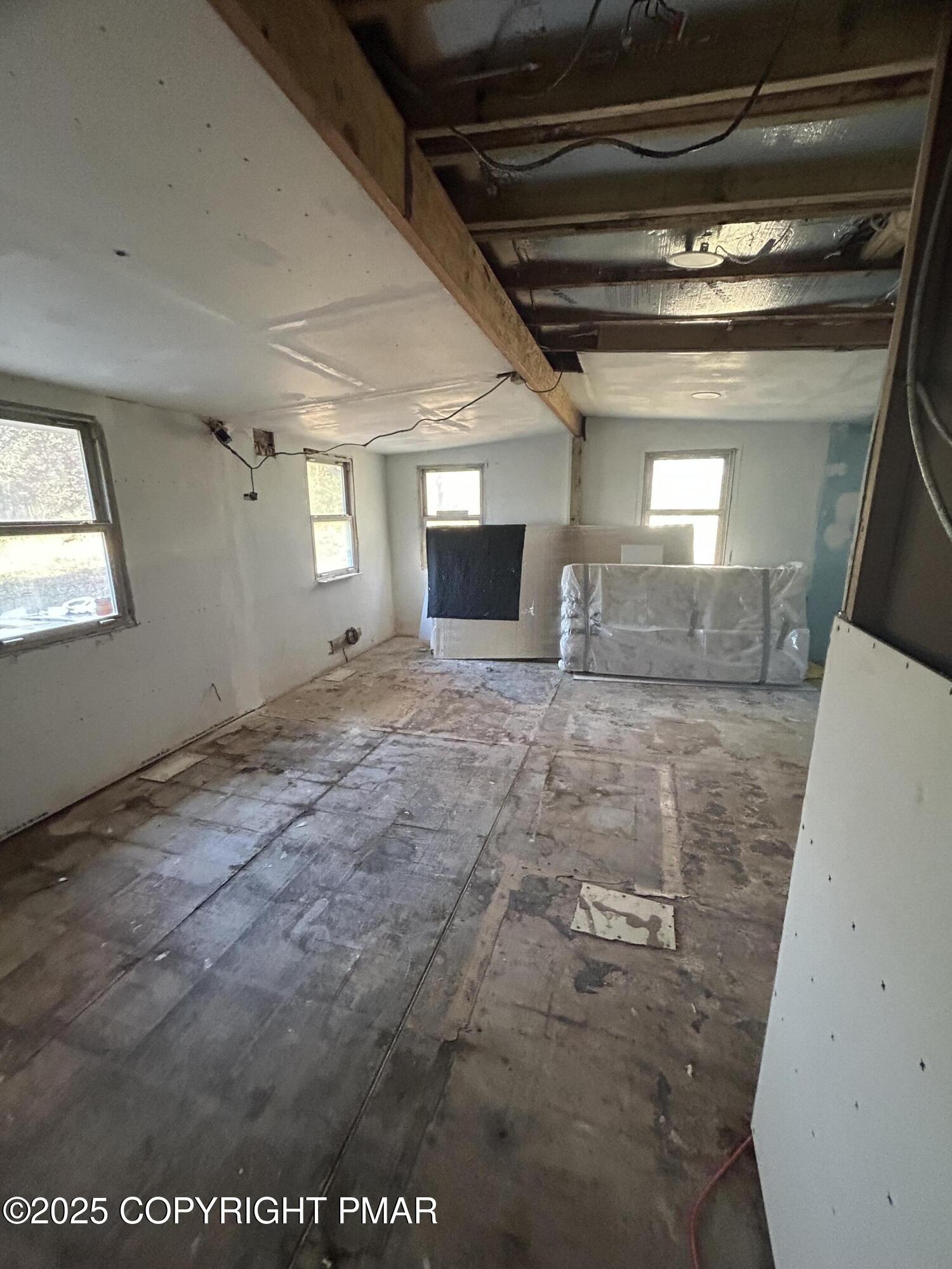 1280 Old Coach Drive Blakeslee, PA 18610 - Photo 4 of 5 a view of a hallway with wooden floor and staircase