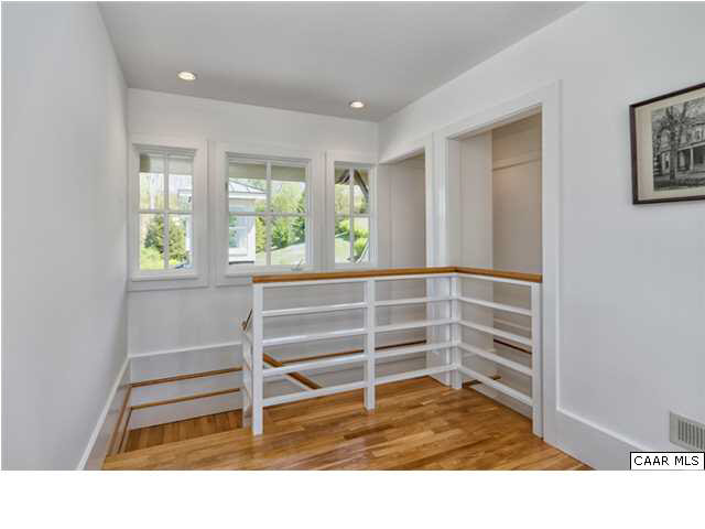 8352 Faber Road Faber, VA 22938 - Photo 20 of 32 The stairs in the addition are beautifully fashioned with curving handrails.This view is at the top of the steps and shows the cupola above the diningroom table below just outside the window.