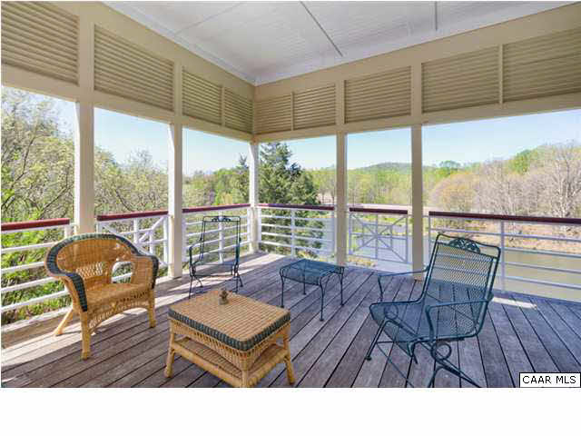 8352 Faber Road Faber, VA 22938 - Photo 10 of 32 This generous porch is the grand stand for watching all the happenings in the pond and woods beyond.