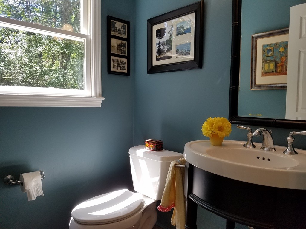 16 Cadorette Road Ashland, MA 01721 - Photo 16 of 29 a bathroom with a toilet a sink and a window