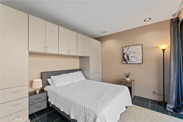 a bedroom with a bed and a cabinets