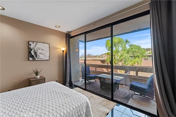 a bedroom with a bed and a desk