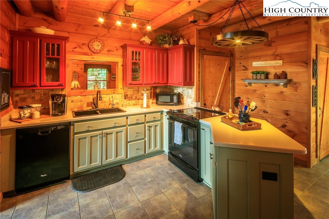 2137-2139 Little Laurel Road Creston, NC 28615 - Photo 13 of 49 a kitchen with a sink stove and cabinets