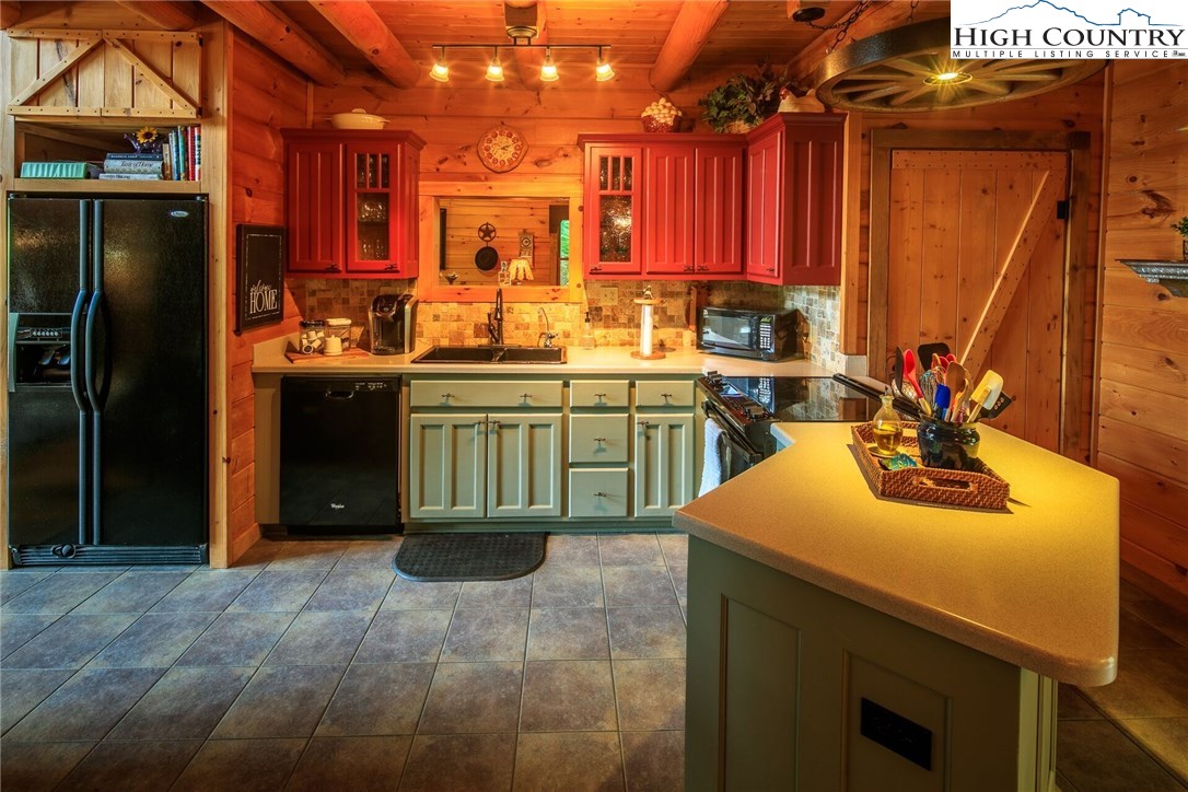 2137-2139 Little Laurel Road Creston, NC 28615 - Photo 14 of 49 a kitchen with a sink and cabinets