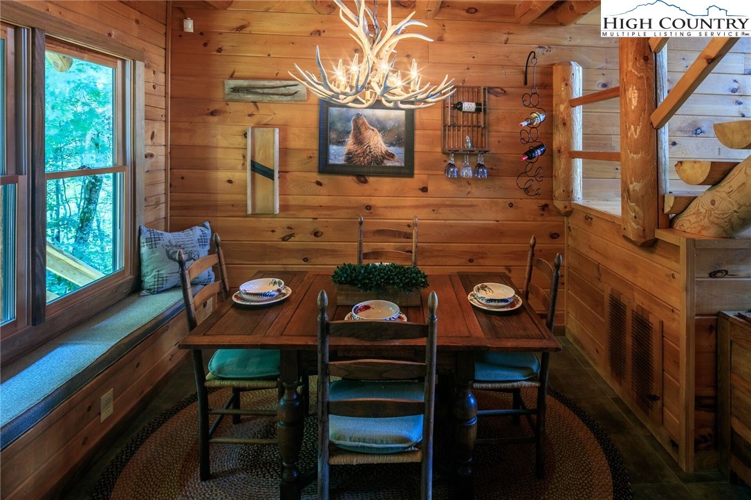 2137-2139 Little Laurel Road Creston, NC 28615 - Photo 16 of 49 a view of a dining room with furniture and window