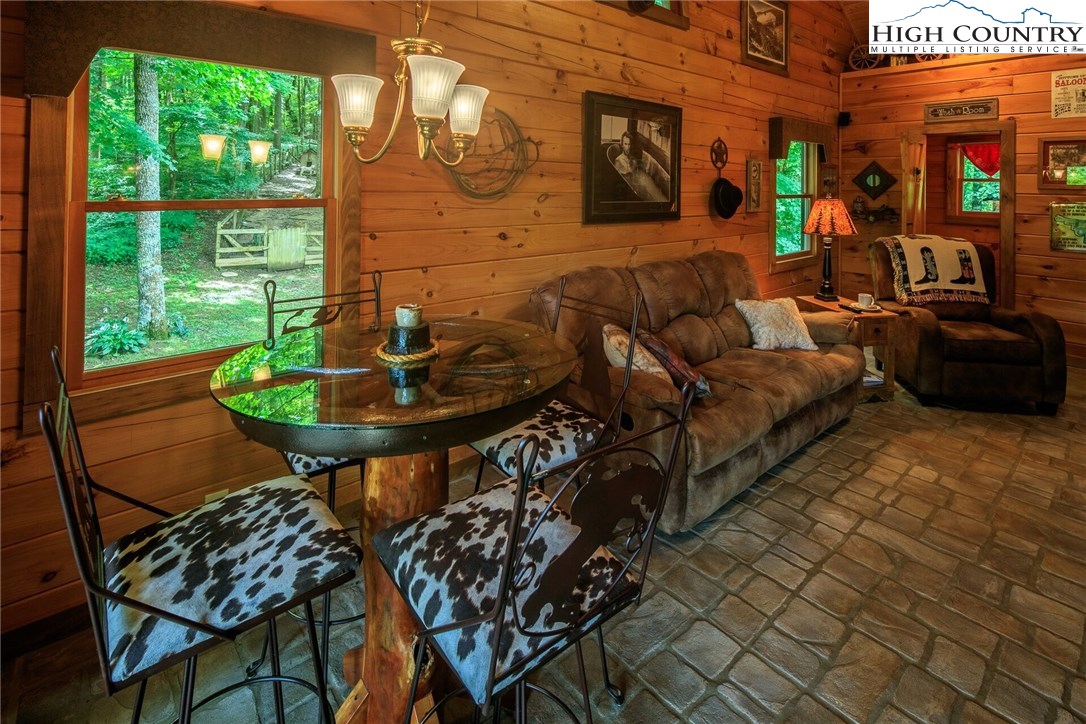 2137-2139 Little Laurel Road Creston, NC 28615 - Photo 19 of 49 a outdoor living space with furniture and a fireplace