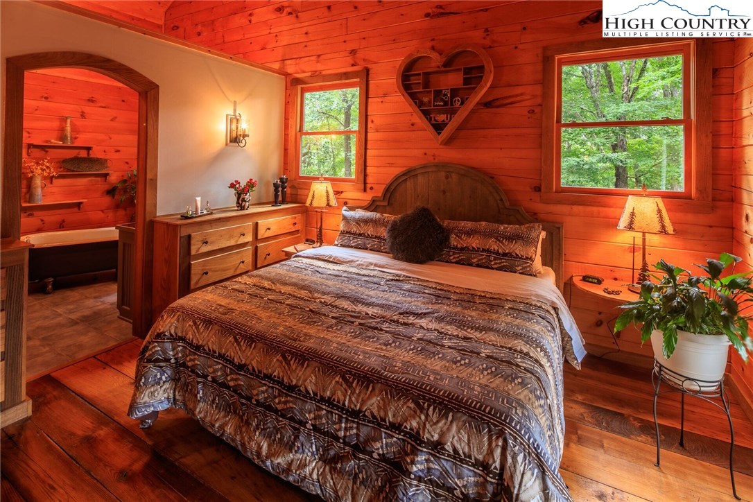 2137-2139 Little Laurel Road Creston, NC 28615 - Photo 24 of 49 a bedroom with a bed and a window