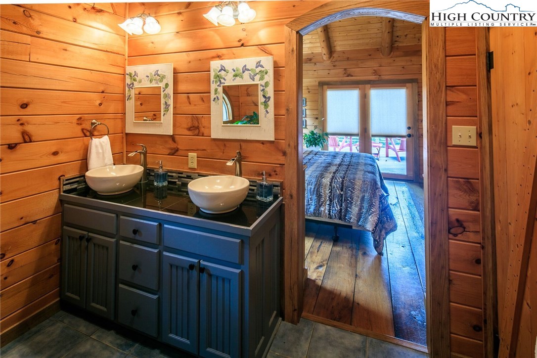 2137-2139 Little Laurel Road Creston, NC 28615 - Photo 25 of 49 a bathroom with a sink and a mirror