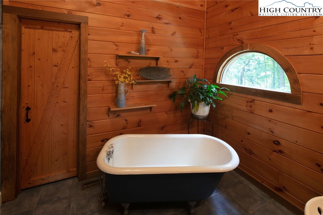 2137-2139 Little Laurel Road Creston, NC 28615 - Photo 26 of 49 a bathroom with a sink and bathtub