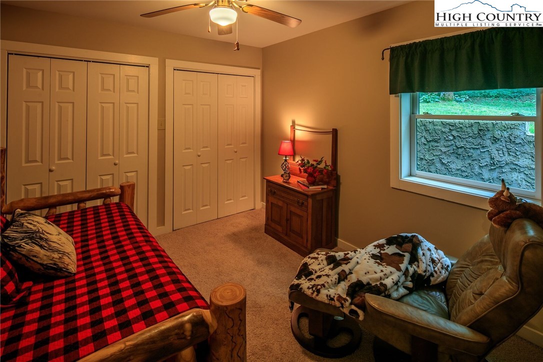 2137-2139 Little Laurel Road Creston, NC 28615 - Photo 30 of 49 a bedroom with bed and a window