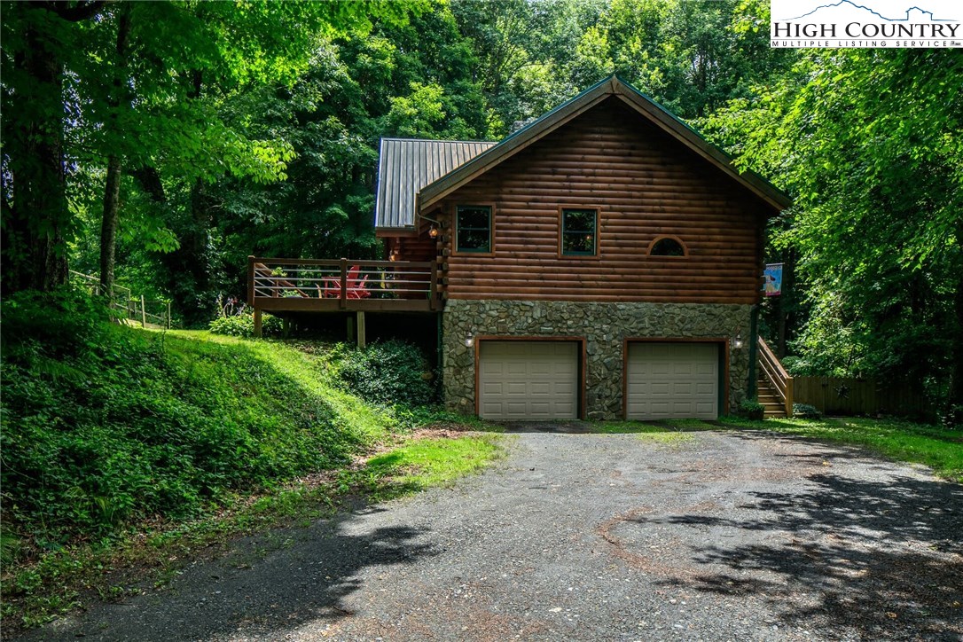 2137-2139 Little Laurel Road Creston, NC 28615 - Photo 31 of 49 a front view of house with a garden