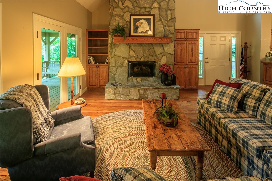 2137-2139 Little Laurel Road Creston, NC 28615 - Photo 35 of 49 a living room with furniture and a fireplace