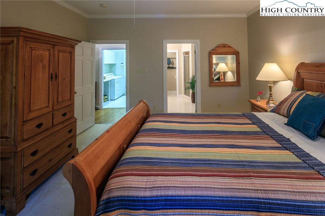 2137-2139 Little Laurel Road Creston, NC 28615 - Photo 38 of 49 a spacious bedroom with a bed and window