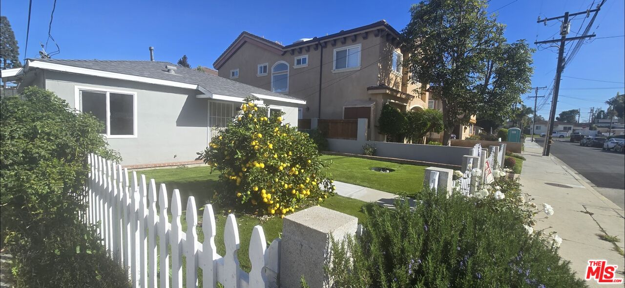 2221 Bataan Road, Unit A Redondo Beach, CA 90278 - Photo 3 of 16 a front view of a house with a yard