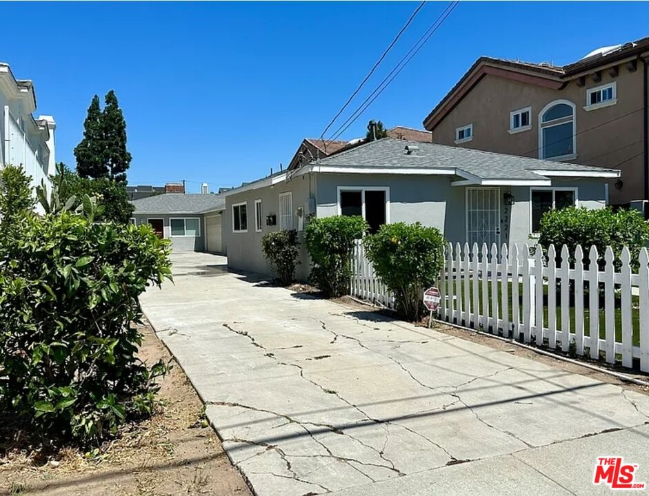 2221 Bataan Road, Unit A Redondo Beach, CA 90278 - Photo 4 of 16 a front view of a house with a yard