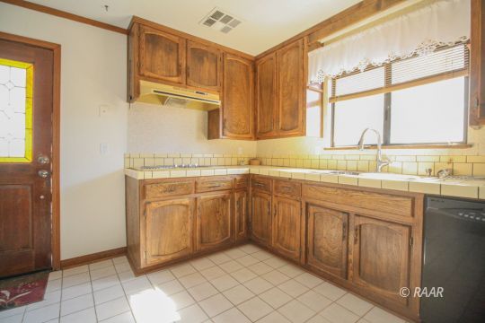 4664 West Ridgecrest Boulevard Ridgecrest, CA 93555 - Photo 13 of 33 a kitchen with stainless steel appliances granite countertop a sink and a cabinets