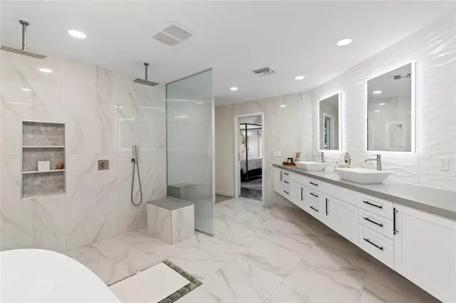 a bathroom with a bathtub and shower