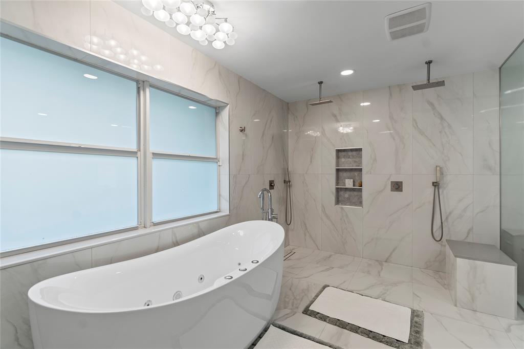 11391 Sundance Lane Boca Raton, FL 33428 - Photo 23 of 58 a bathroom with a tub a toilet and a shower