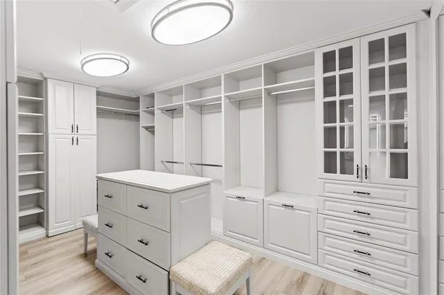 a bedroom with a bed and a table