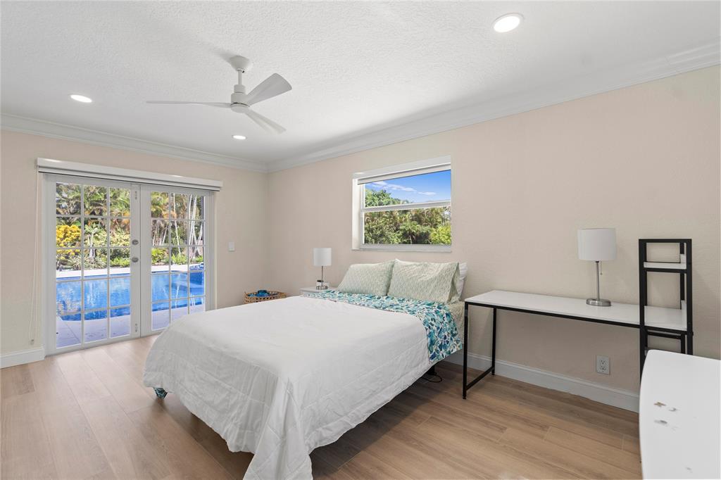 11391 Sundance Lane Boca Raton, FL 33428 - Photo 26 of 58 a bedroom with a large bed and a window