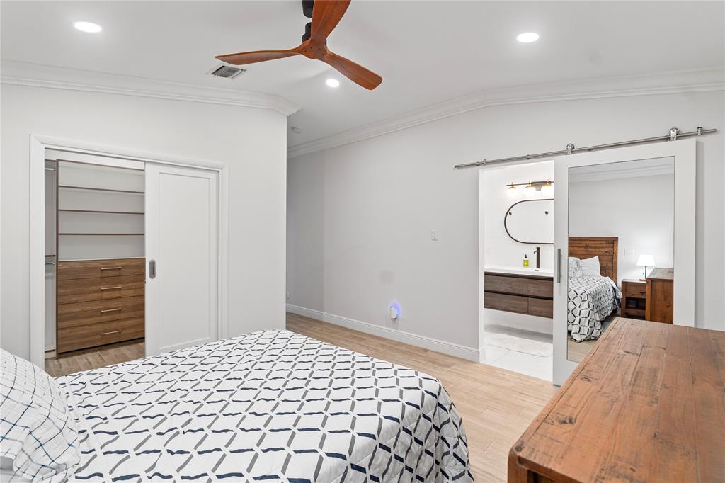 11391 Sundance Lane Boca Raton, FL 33428 - Photo 29 of 58 a bedroom with a bed and a dresser