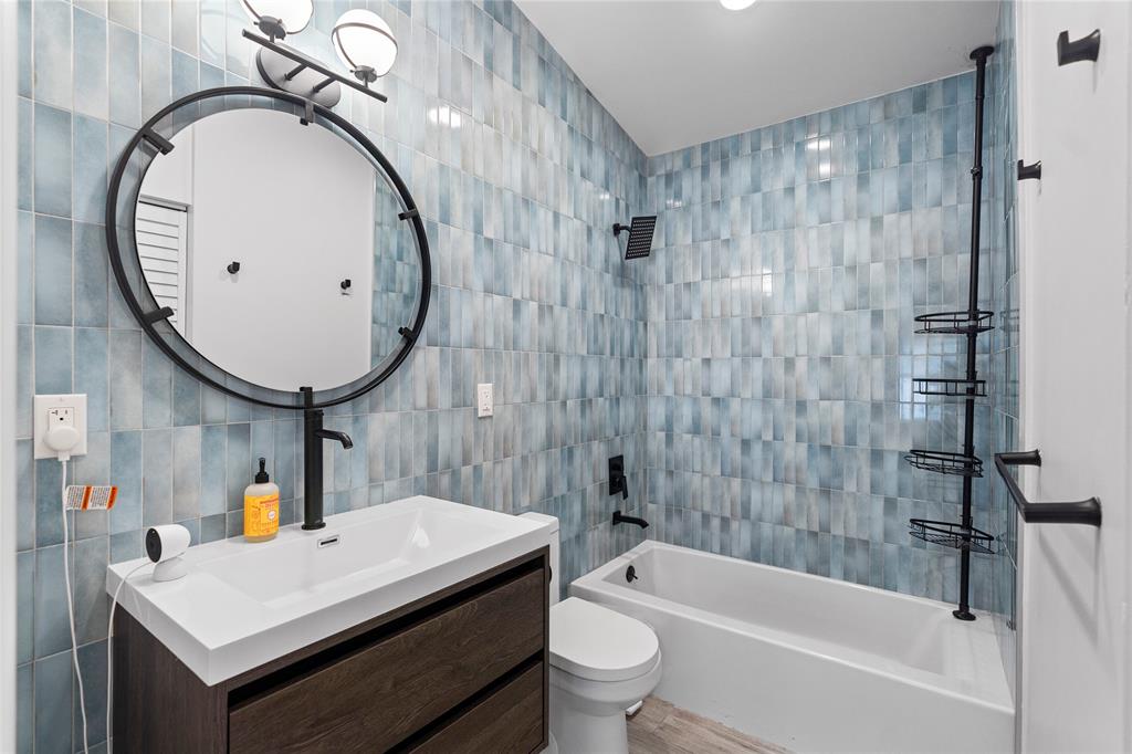 11391 Sundance Lane Boca Raton, FL 33428 - Photo 31 of 58 a bathroom with a sink a toilet and shower